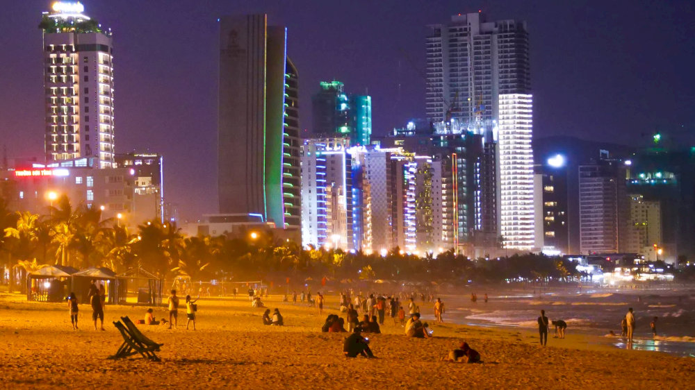 Feel the cool air as you wander along the beach at night